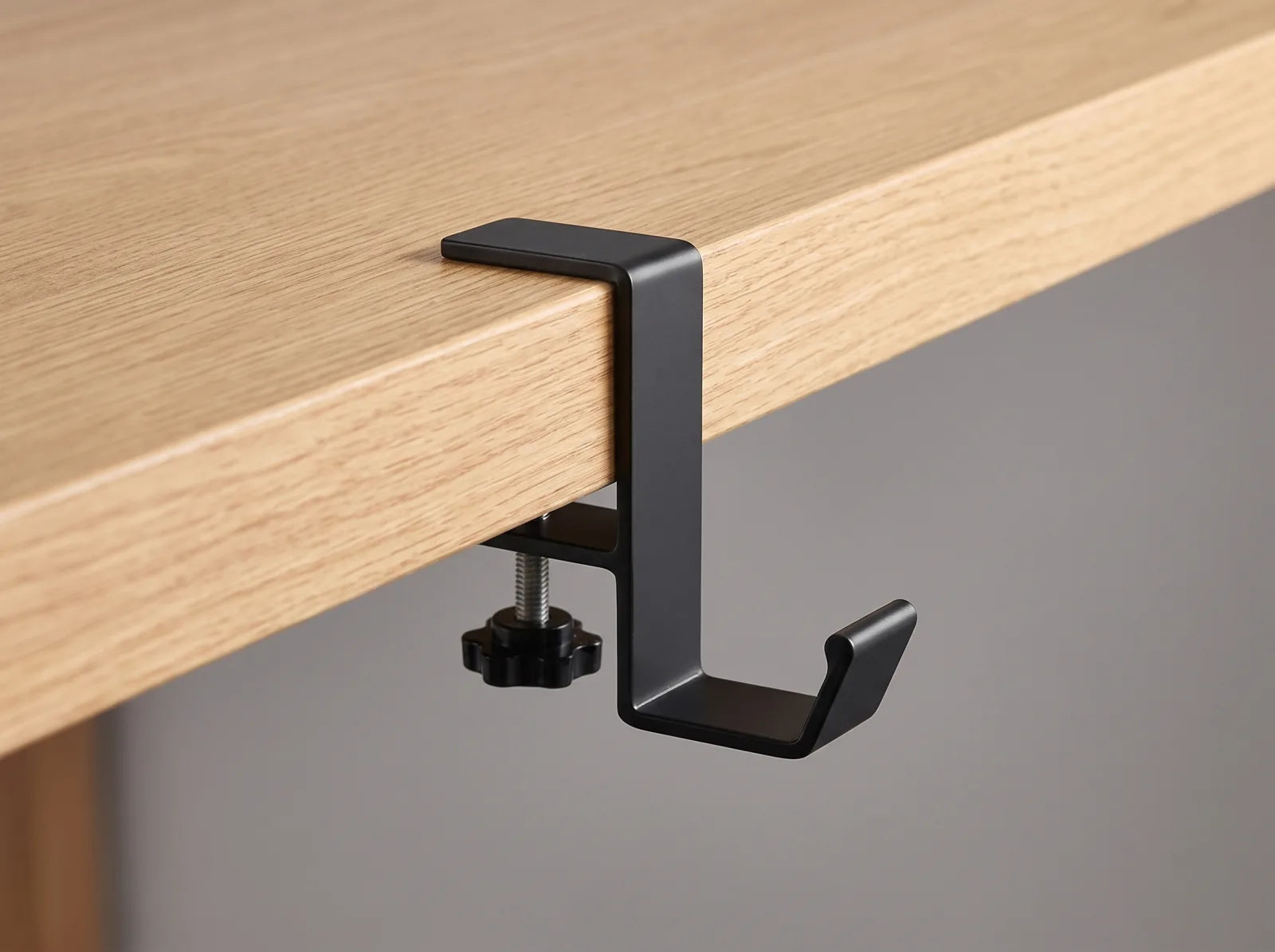 It grips the desk. That is the whole idea.