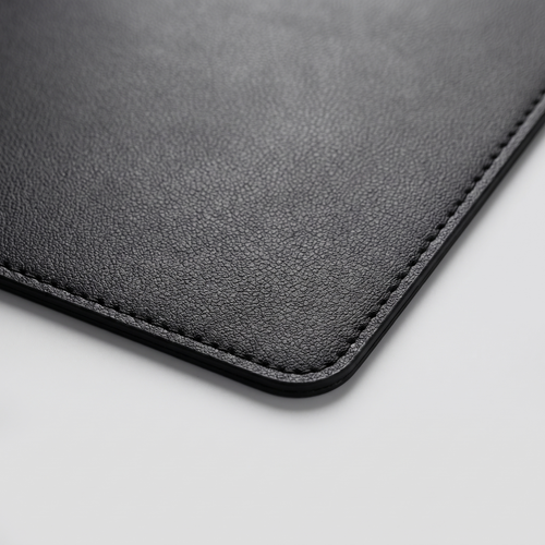 Close-up of the stitched edge of the Deskstead Desk Pad