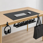 The Edge System set up on a desk: tray underneath, hooks on the edge, pad on top
