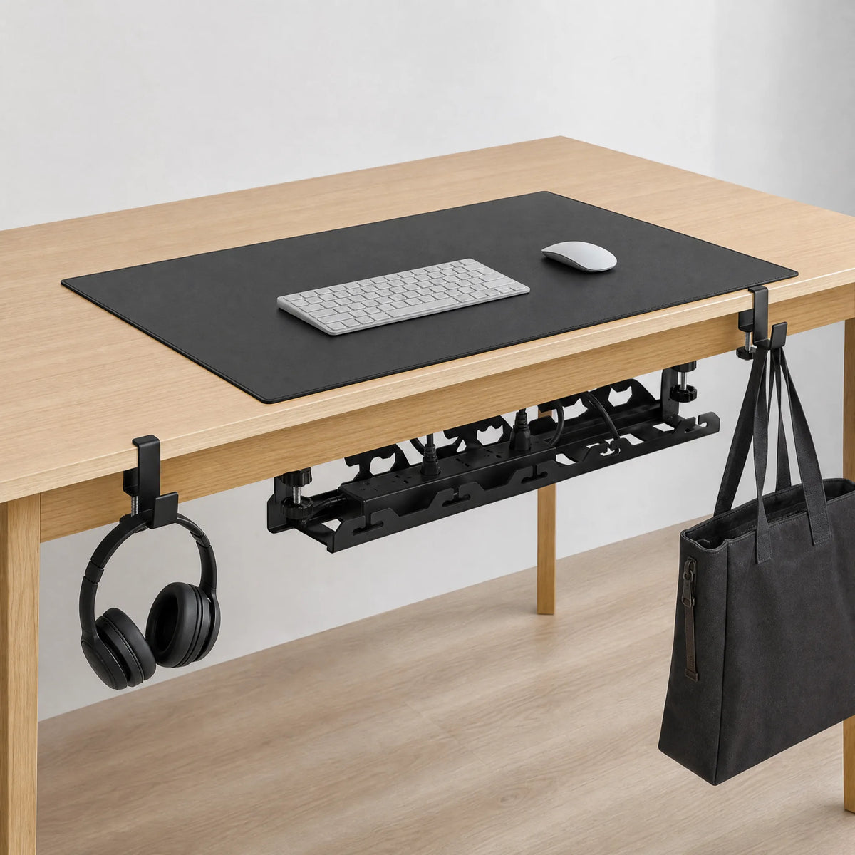 The Edge System set up on a desk: tray underneath, hooks on the edge, pad on top