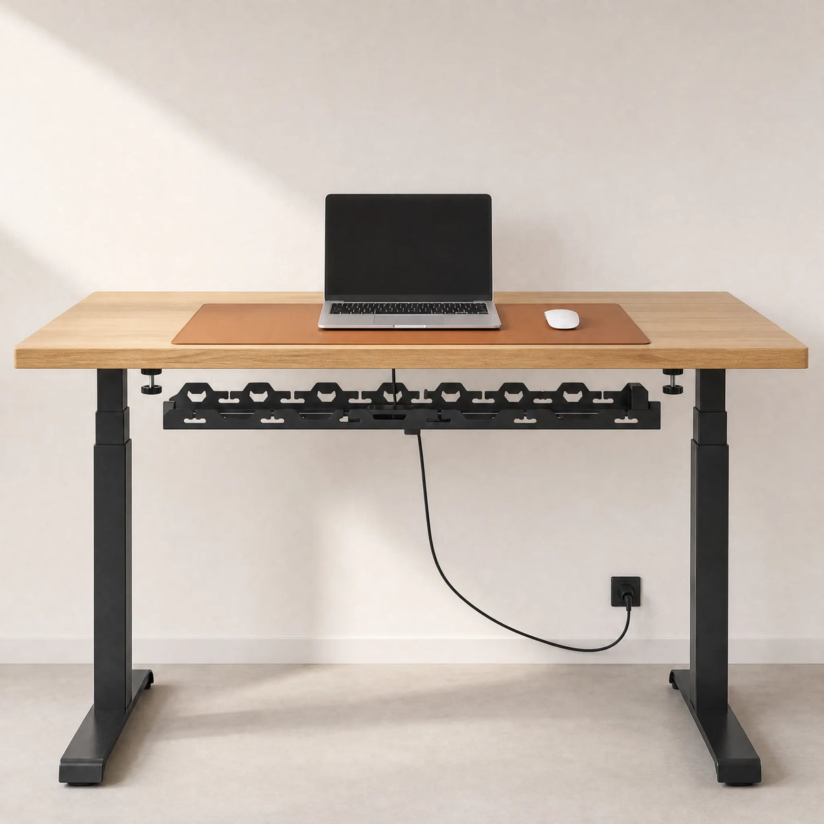 A desk with the Edge System installed and a single cable running to the wall